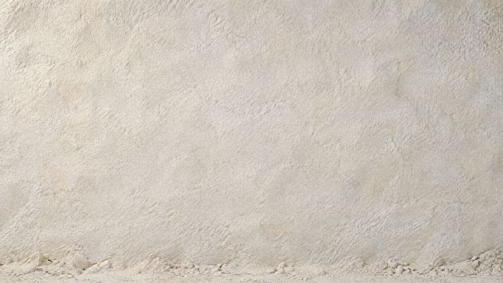 A smooth, pale chalk wall, evenly lit and ready for scratching.